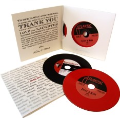 Two vinyl CDs in double record-style four page card sleeves