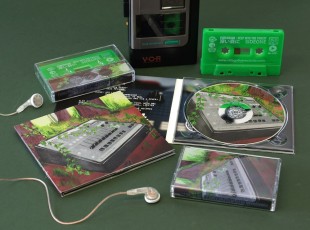 A matching set of green cassettes with white on-body printing and CDs in digipaks