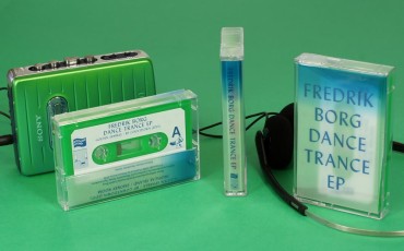 Green cassettes in clear shells that use tracing paper J-cards for a frosted semi-transparent effect