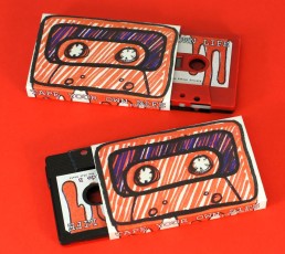 Our black and red sandwich cassettes with hand-drawn style stickers and O-cards