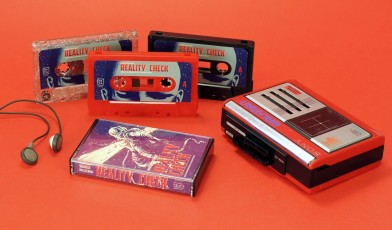 A set of red, black and silver,red and green glitter cassettes with J-cards and black back cases