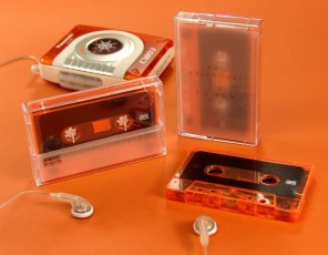Transparent orange cassette tapes with tracing paper inserts