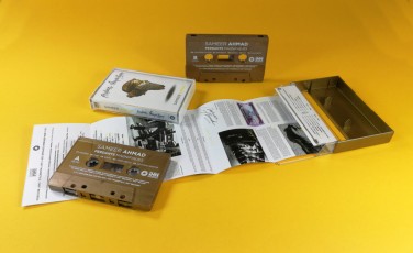 Vintage bronze cassette tapes with white on-body printing in gold cassette cases with clear front windows