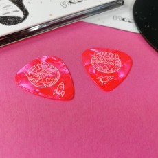 Pink guitar picks with a single colour cream print for Luna and the Moonhounds
