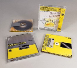 MiniDiscs with full coverage top and spine printing, packed in clear jewel cases with double sided J-cards