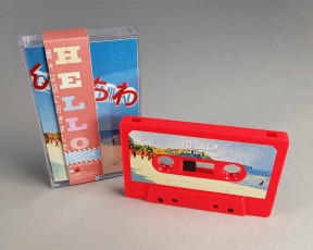Neon pink cassettes with full colour sticker printing, J-cards, clear cases and outer vertical obi strips