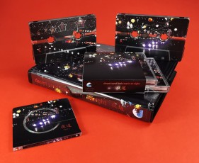 desert sand feels warm at night box set with two MiniDiscs in jewel cases within an outer O-card, plus custom printed cassette tapes in a double rave case