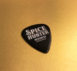 Black guitar picks with full colour printing, produced for Spice Hunter rum