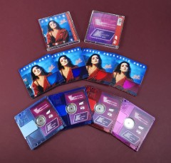 Clear transparent MiniDiscs, printed with light blue, dark blue, red and pink tints and full colour artwork