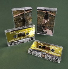 Gold metallic liner cassette tapes with white printing and packed in clear cases with J-cards