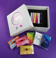 White cassette tape presentation box with a magenta foil lid print and six tapes inside