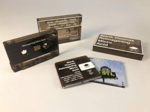 Clear brown smokey cassettes and cases with white on body printing, and clear MiniDiscs with full colour front and back print