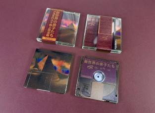 Clear MiniDiscs with full colour front print and transparent back print in jewel cases with J-cards finished with Obi strips