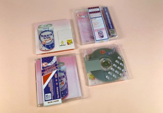 Clear MiniDiscs with full colour front print and transparent back print in jewel cases with J-cards finished with Obi strips