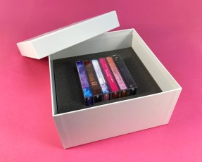 Six cassette tape box set with white foil lid and base print and custom foam insert to hold cassette tapes