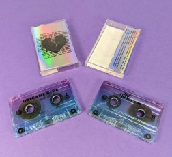 Cassette tapes with J-cards printed on holographic board