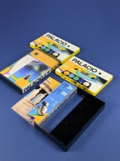 Yellow cassette shells with on body printing in black backed cases with full colour printed J-cards