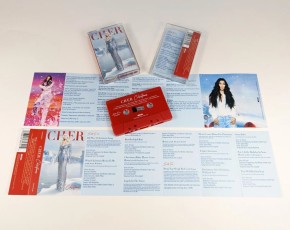Solid red cassette tapes with white on-body printing in cases with J-cards