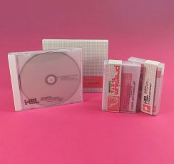 Cassette tapes in clear frosted cases with obi strips and CD jewel cases with white trays, tracing paper inserts and outer O-cards