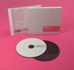 CD jewel cases with white trays, tracing paper inserts and outer O-cards.