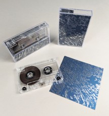 Clear prison tapes with white on-body printing and silver foil printed J-cards on the Stardream 'Lapislazuli' blue metallic card