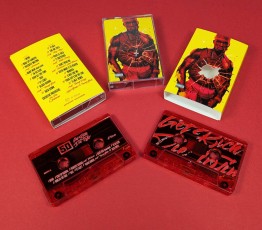 Custom cassette case outer O-cards with a bullet hole cut-out to show the case art below
