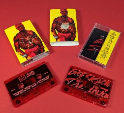 Custom cassette case outer O-cards with a bullet hole cut-out to show the case art below