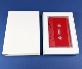 Custom sliding matchbox for a cassette tape in a Norelco case with inner padding