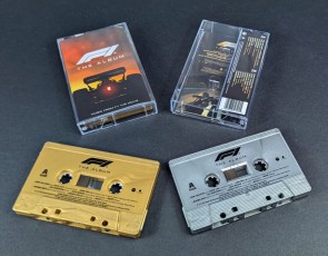 F1 The Album film soundtrack on vintage gold and silver cassette tapes