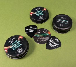 Black guitar pick tins with printed lids and bases, plus guitar picks and printed insert
