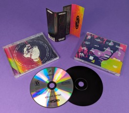 CD jewel cases with white on-body printing and end-fold obi-strips