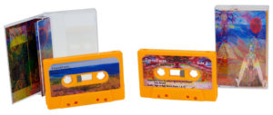 Orange cassettes with full colour stickers and printed cases