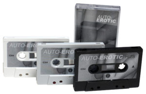 White, grey and black cassettes with black and white sticker printing and matching J-cards