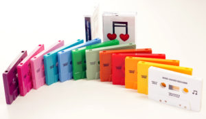 A rainbow selection of 12 different cassette shell colours with an on-body black print
