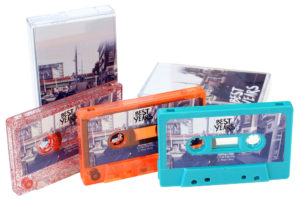 A set of red glitter, orange transparent and turquoise cassettes