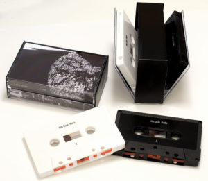 Black and white cassettes with on-body print in double butterfly cases