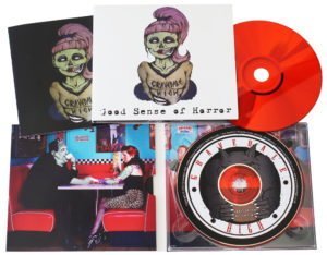 Red CDs in 4 page digipaks with a booklet