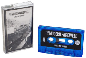 A set of blue transparent cassettes with printed J-card inserts