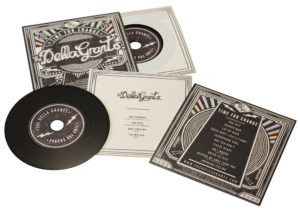 Vinyl CDs in printed card wallets with a larger outer printed wallet and finished with cellophane wrapping