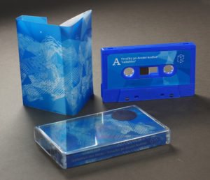 Sharmi blue cassettes with full colour stickers and tracing paper semi-transparent multi panel J-cards printed on one side