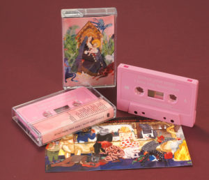 A set of baby pink cassettes with white on-body printing