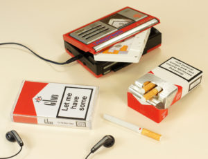 White cassettes in a clear cassette cases with Marlboro-style J-cards