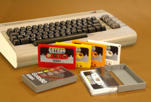 An interesting set of four different colour cassettes in grey cases with audio generated on a Commodore 64 and Roland TR-808 composer