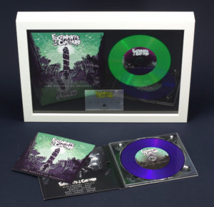 A4 white frame with digipak cover, green vinyl CD and printed plaque