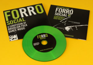 Green vinyl CDs in standard printed card wallets