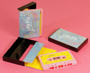 A set of baby pink cassettes in black cases with J-cards