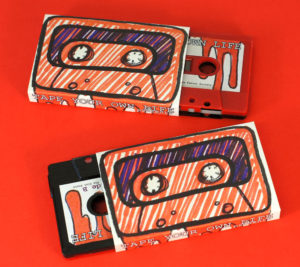 Our black and red sandwich cassettes with hand-drawn style stickers and O-cards