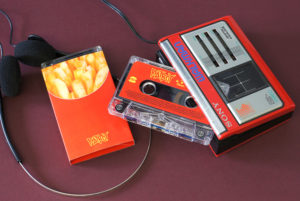 Clear cassettes in French fries O-cards for the 'Move' single release by Rat Boy