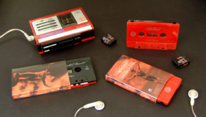 Red and black sandwich cassettes with silver on-body printing and packed in full colour printed O-cards