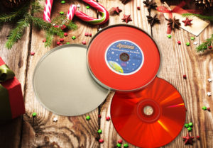 A red vinyl CD with full colour printing, supplied in a metal CD tin with foam insert
